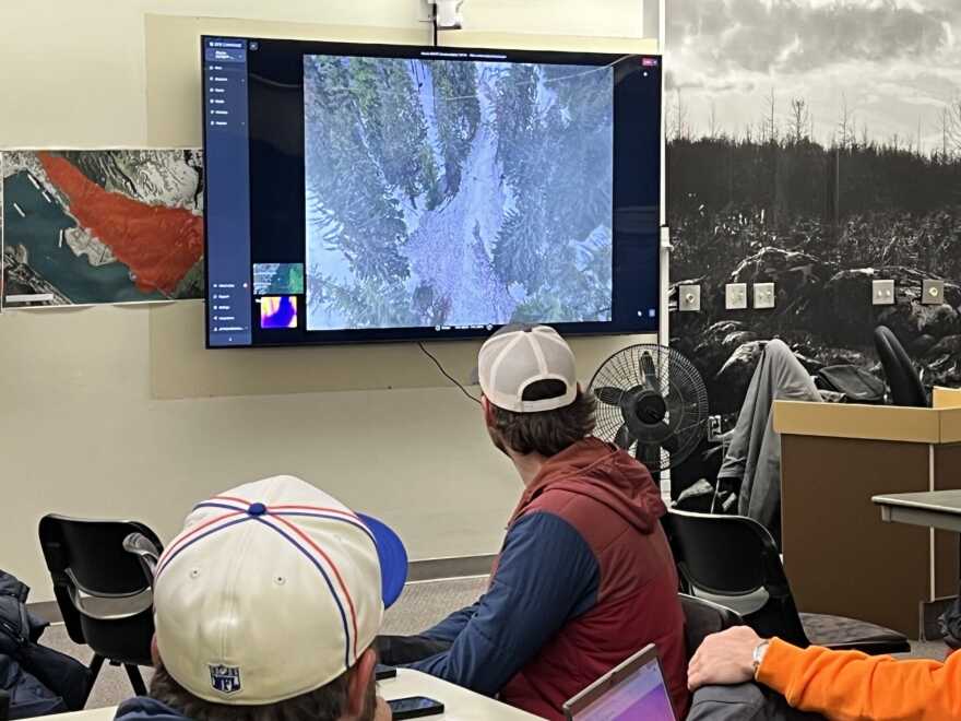 Avalanche forecasters view drone footage avalanche paths at City Hall on Jan. 12, 2025.