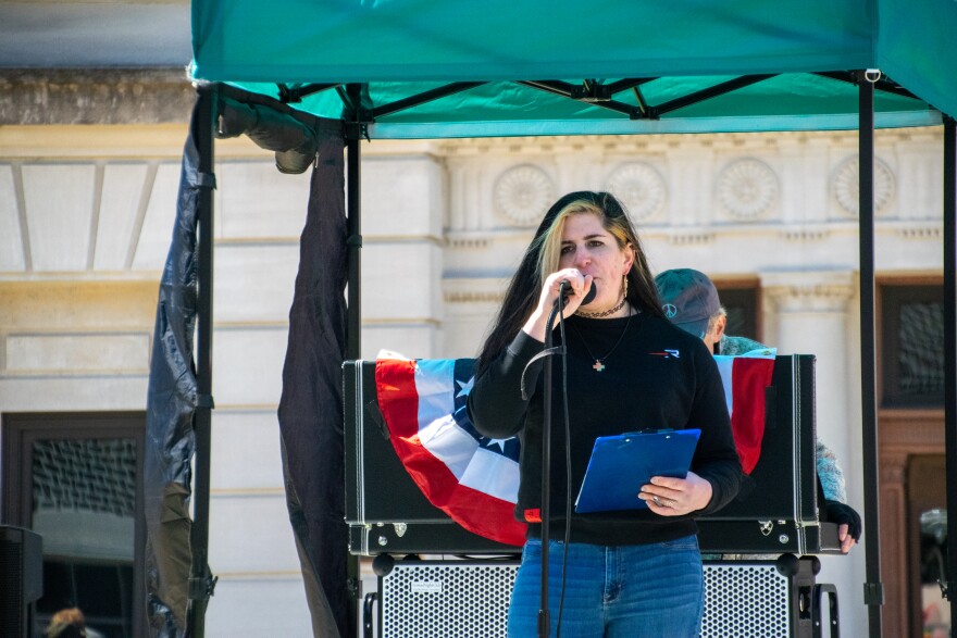 Chloe Andis gives a speech halfway through the No Kings protest on Saturday. Andis is currently running for Indiana State Senate Disctrict 15.