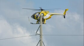  Many of the electricity lines along the Keys are over water and require constant maintenance — often by helicopter.