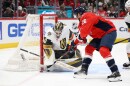 Washington Capitals center Nic Dowd (26) tries to get the puck past Vegas Golden Knights goaltender Akira Schmid (40) during the first period of an NHL hockey game, Friday, Feb. 27, 2026, in Washington. (AP Photo/Nick Wass)