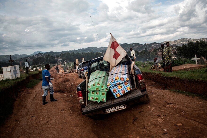 Coffins containing the bodies of two people who died of Ebola are brought to a cemetery in Butembo for burial on May 16. The case count in the 10-month-long outbreak topped 2,000 this week.