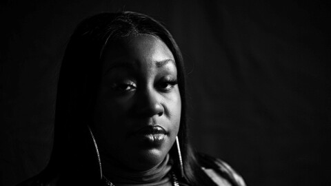 A black and white photograph of Buffalo emcee Pretty Bulli