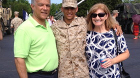 Marine Capt. Cristian Alphonso, center, pictured with his parents, Bonny, left, and Karen, right, in 2014. Alphonso was unable to visit his parents before an upcoming deployment because of Defense Dept. travel restrictions.