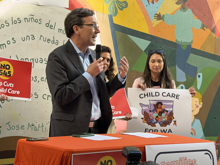 Gov. Bob Ferguson talks into a microphone.