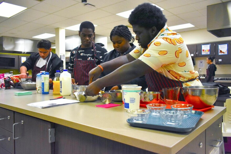 Students in a nutrition class at Pike High School make smoothies.