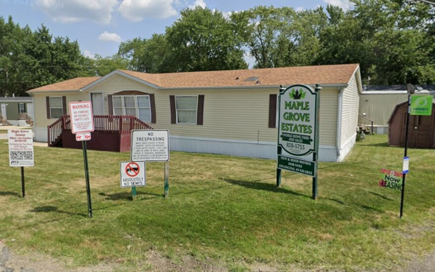 A sign outside the Maple Grove Estates mobile home park