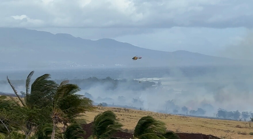 Helicopters dropped water on Saturday on the Olowalu brush fire burned more than 100 acres.