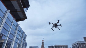 This February 2017 photo provided by DJI Technology Inc. shows a test of a type of drone in downtown Denver, that the New York Police Department can use to reduce risk to officers and bystanders during a response to dangerous situations. The department said Tuesday, Dec. 4, 2018, that potential uses for its 14 drones include search and rescue, hard-to-reach crime scenes, hostage situations and hazardous material incidents. (DJI Technology Inc. via AP)