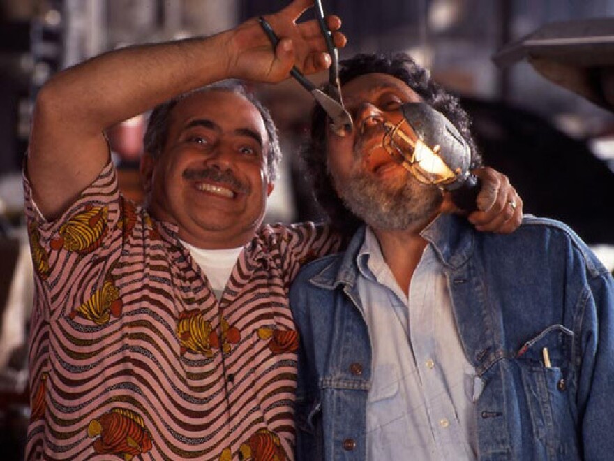 Ray, left, doing some dental work on Tom.