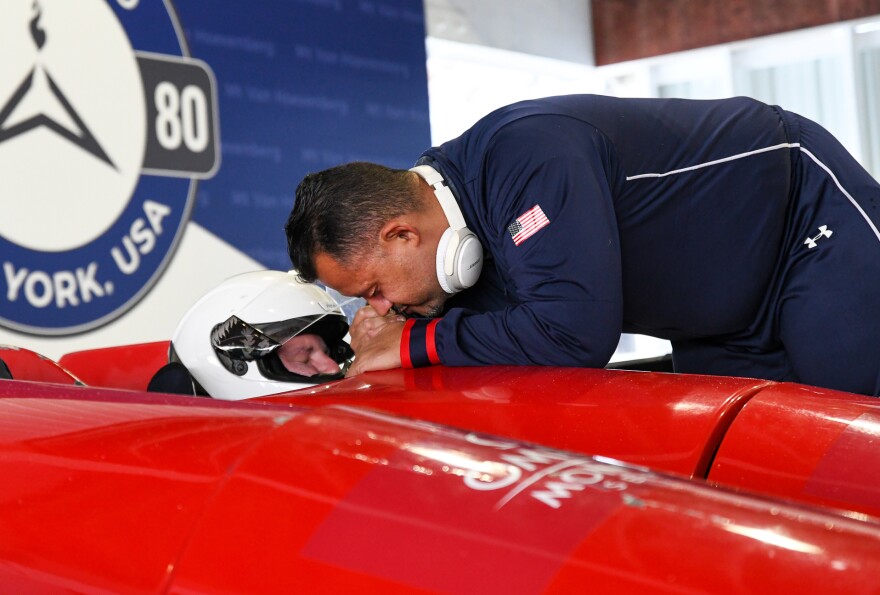 Team U.S.A.'s Will Castillo, right, says a prayer with teammate, David Christopher, moments before Christopher makes his first trial run at the Para Bobsleigh World Cup at Mount Van Hoevenberg in Lake Placid, N.Y., Friday, Nov. 18, 2022.