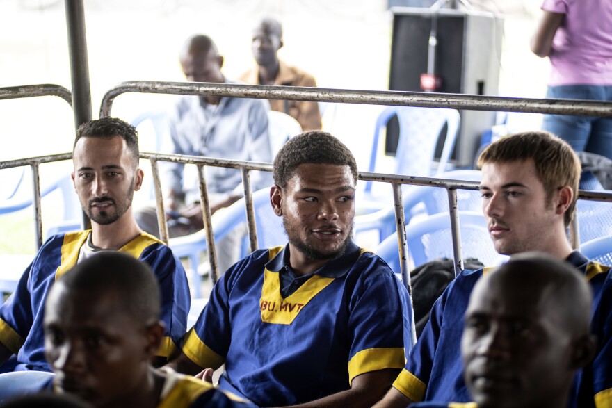 Three American citizens attend a court verdict in Congo, Kinshasa, Friday Sept. 13, 2024, on charges of taking part in a coup attempt in May 2024. Benjamin Reuben Zalman-Polun, left, and Utah natives Marcel Malanga and Tyler Thompson.