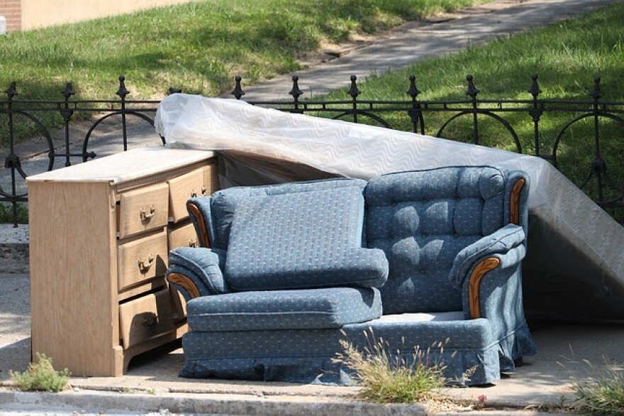 Furniture sitting on a sidewalk curb