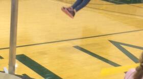 Mia Korn, an eight-year-old from McGrath, executes a two-foot high kick at the Junior Native Youth Olympics on February 24, 2018. (Johanna Eurich/KYUK)