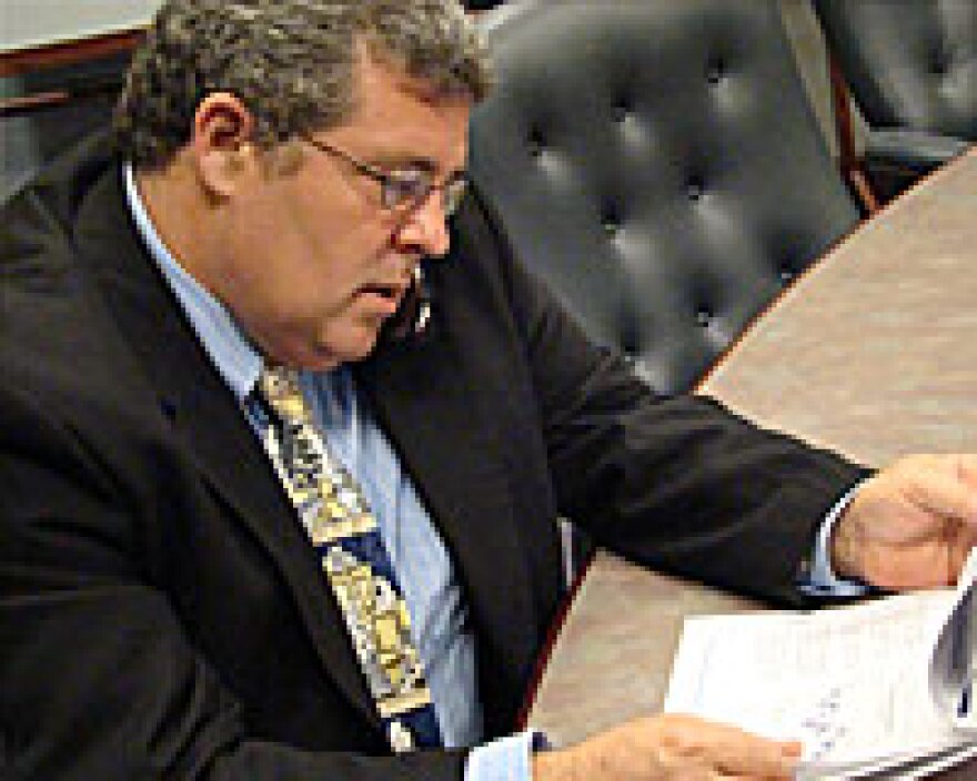 Rep. Frank Mautino reviews a COGFA report.