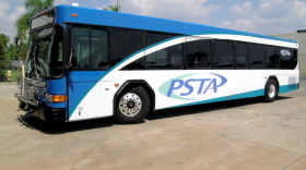A blue and white bus with PSTA written on the side
