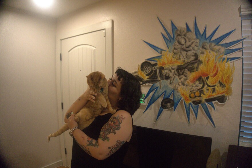 2 BED 1 BATH founder Ryan Semegran exhibits from their Oak Cliff apartment. Also pictured: the gallery mascot, Garfunkel the cat.