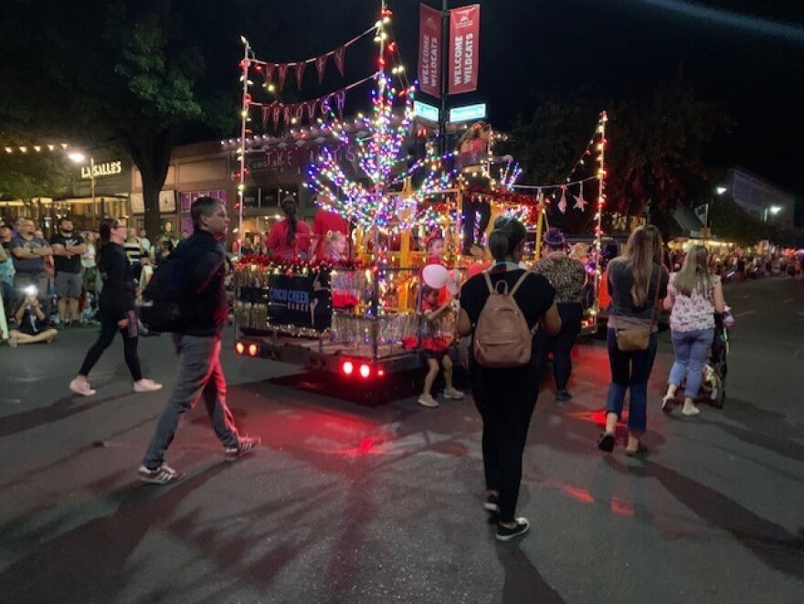 Chico Creek Dance team members greet the crowd during the Chico Parade of Lights on Saturday, Oct. 15, 2022, in Chico, California.