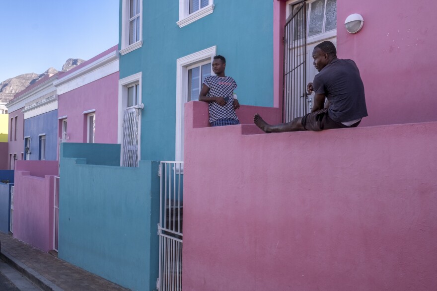 Young men pass the time on their front porch in Bo Kaap, a predominantly Muslim area of central Cape Town and a popular tourist site. Out of work since the start of South Africa's coronavirus lockdown, the men say they are worried that their savings will not last much longer.