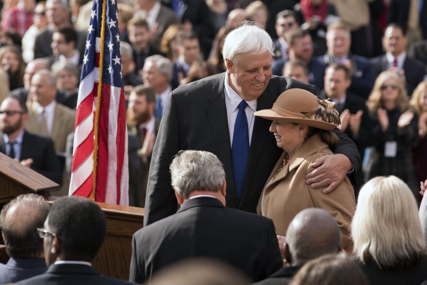 West Virginia Gov. Jim Justice and his wife, Cathy, embrace during his inauguration ceremony in Charleston, W.Va., Monday, Jan. 16, 2017.