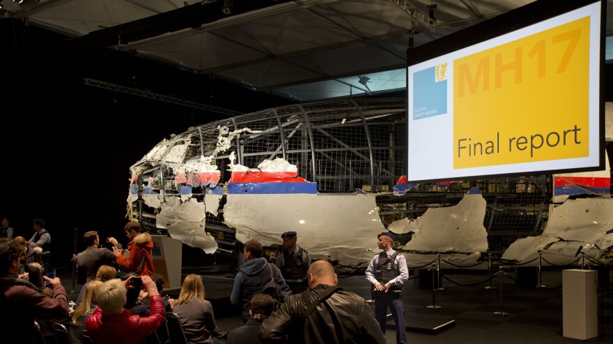 Part of the reconstructed Malaysia Airlines Flight 17 plane is seen prior to the presentation of the Dutch Safety Board final report on what caused the Boeing 777 to break up high over eastern Ukraine last year.
