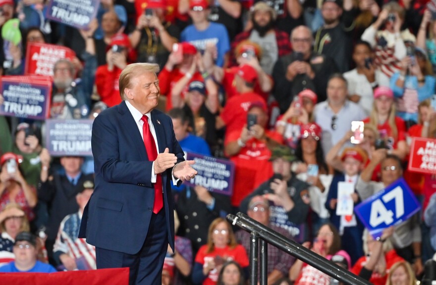 President Donald Trump applauds during his campaign rally Oct. 9, 2024, at Riverfront Sports in Scranton