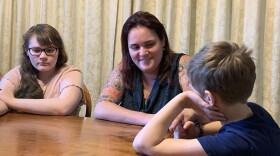 Agatha Walston talks with her two children.