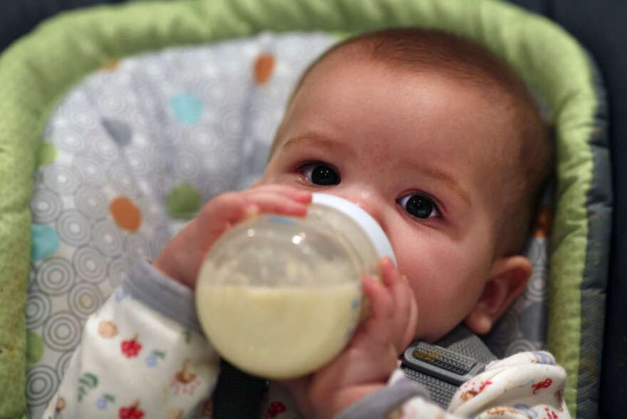 A nine month old baby girl at meal time. Photo Tim Clayton (Photo by Tim Clayton/Corbis via Getty Images)