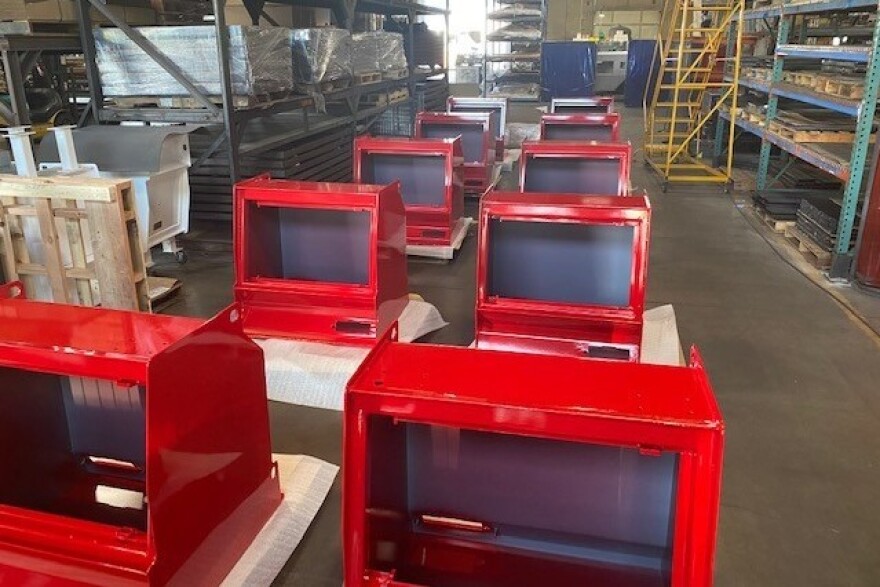 Ballot boxes are under construction at Laserfab Inc.'s factory. The company says it's seen a bump in orders this year as absentee voting has expanded.