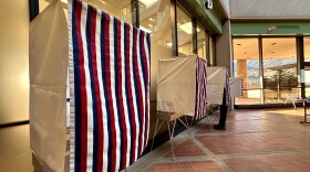 A voter casts an early vote in Juneau at the State Office Building on Oct. 26, 2026.