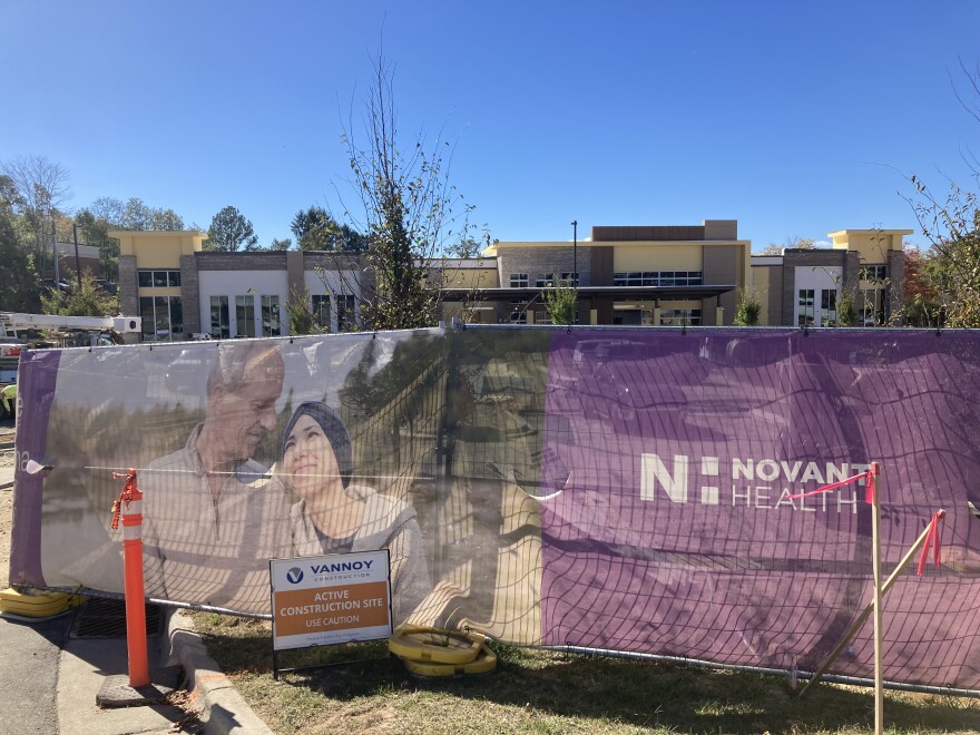 A sign outside the Novant Health South Asheville Medical Plaza, which is under construction, on October 16, 2025. Novant is one of four hospital systems applying for a Certificate of Need in Buncombe County.
