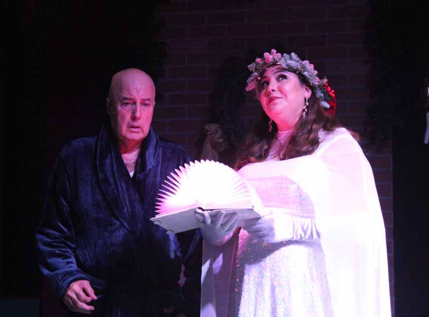 Russell Watson and Ariana Milian are Ebenezer Scrooge and the Ghost of Christmas Past for the red cast in Fort Myers Theatre's production of 'A Christmas Carol.'