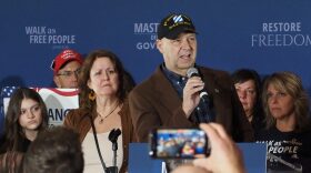 State Sen. Doug Mastriano addresses supporters from a stage at his gubernatorial campaign's election night headquarters in Camp Hill on Nov. 8, 2022.