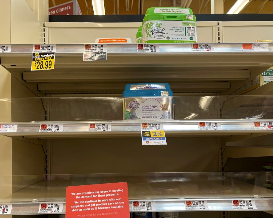 Empty shelves of baby formula at a grocery store