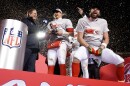 Kansas City Chiefs quarterback Patrick Mahomes and tight end Travis Kelce, right, celebrate with the Lamar Hunt Trophy after the AFC Championship game against the Cincinnati Bengals on Jan. 29, 2023. The Chiefs won 23-20 on a field goal with three seconds left in the game.