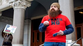 Mitch Linck, 32, of Enfield, Connecticut, is a military veteran who joined protesters outisde the state Capitol on Wednesday. "Working people make this world run. And working people want a livable planet."
