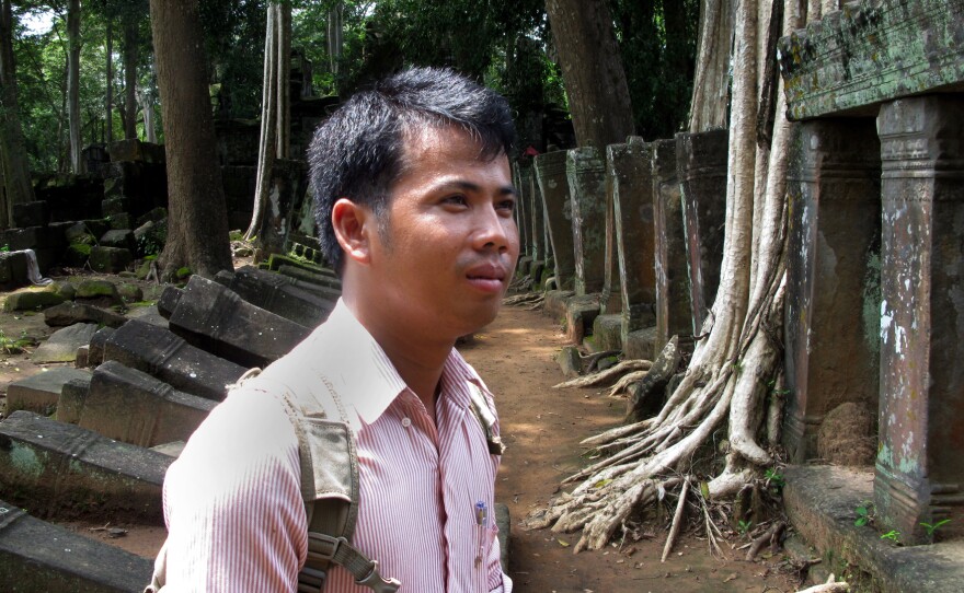Archaeologist Phin Samnang, 29, surveys the ruins of Prasat Chen temple at Koh Ker. He says that unlike in earlier periods, Cambodia now has the means and duty to reclaim its priceless lost antiquities.