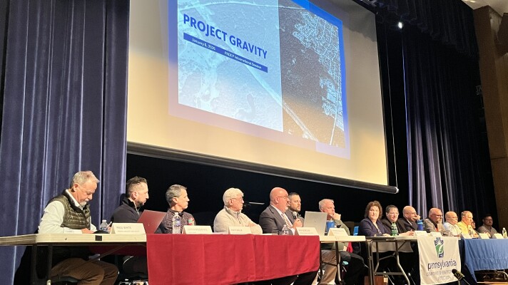 Archbald 25 Developer LLC and Pennsylvania Department of Environmental Protection representatives take questions from community member during a public meeting about the developer's plan to build a data center campus in Archbald.