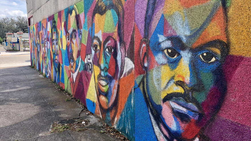 Colorful mural with several faces