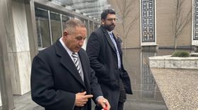 John Trasacco steps out of the federal courthouse in Hartford, where he is on trial for wire fraud and a related conspiracy charge.