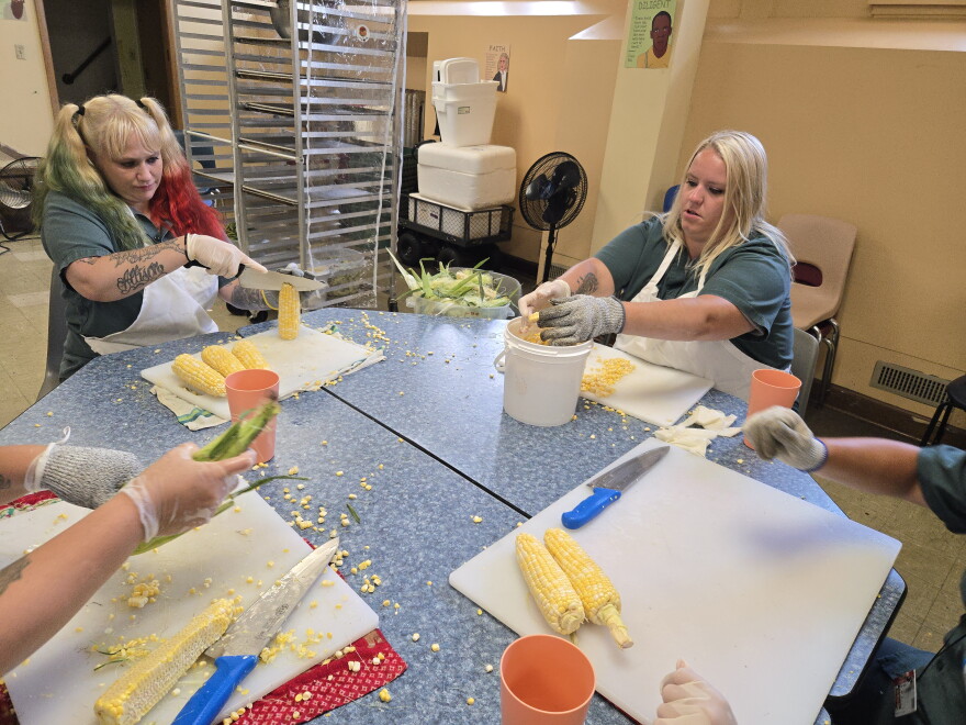 Some volunteers shucked and cut corn.