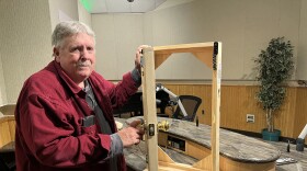 Dave Downing of Audio Air Force poses with a small door used for sound effects in their performances.