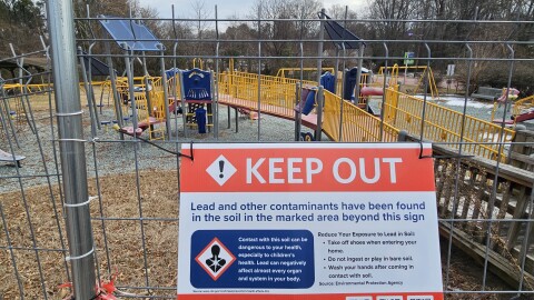 A fence blocks access to the playground area at East Durham Park, which was shut down two years ago due to soil contamination.