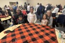 The Hooks family made fringe blankets for Blankets & Broth on MLK Day 2025 on Jan. 20.