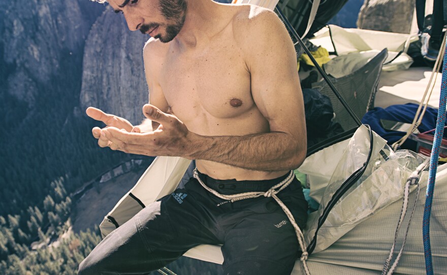 Jorgeson checks to see how much skin has grown back after a night of rest in his portaledge.