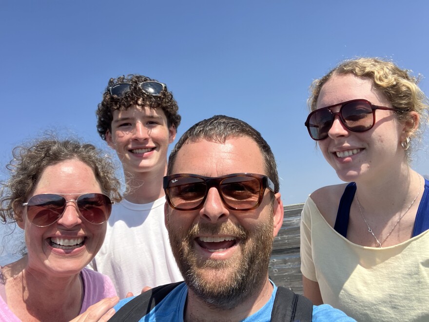 Luke Dennis, center, surrounded by his wife, Sally, and children Oscar and Lucy. 