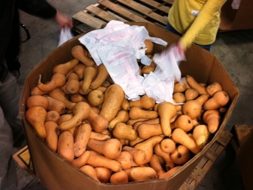 Volunteers at Second Harvest Food Bank of Middle Tennessee sort 50 pallets of  butternut squash. Bringing in more produce is one way food banks plan to meet  new nutrition goals.