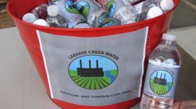 These bottles were on display on a table outside of Powell Hall, where Ameren held its shareholder meeting this morning. They contain creek water from Labadie, Missouri, which supporters of the environmental shareholder proposals say may contain coal ash.