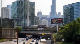A Metra commuter train operated by Illinois' Regional Transportation Authority travels to downtown Chicago over Kennedy Expressway on interstate 90 and 94 in 2022. RTA will be replaced by a new board on Sept. 1.