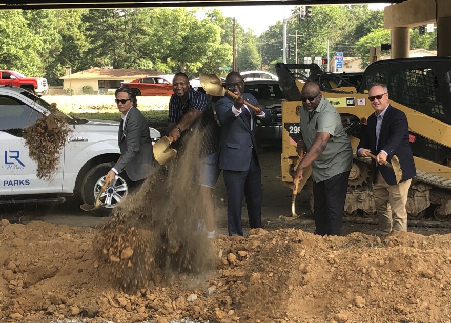 Little Rock Mayor Frank Scott Jr. (center) joins city officials in breaking ground on new improvements to Kanis Park on Monday.