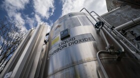 A liquid carbon dioxide containment unit stands outside the fabrication building of Glenwood Mason Supply Company in the Brooklyn borough of New York.